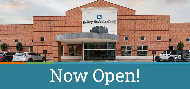 Exterior of the new Kelsey-Seybold Tanglewood Clinic with text reading, "Now Open!"